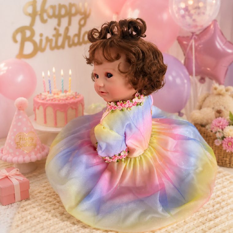 Reborn doll in a celebration dress, gift ready